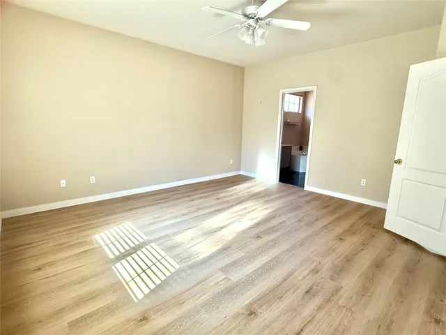 a view of wooden floor and cabinet in a room