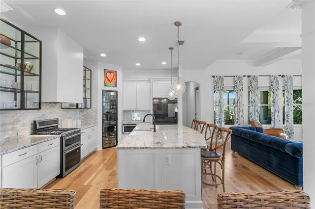 a kitchen with granite countertop a stove and a sink
