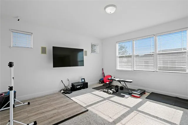 a bedroom with a bed and a mirror