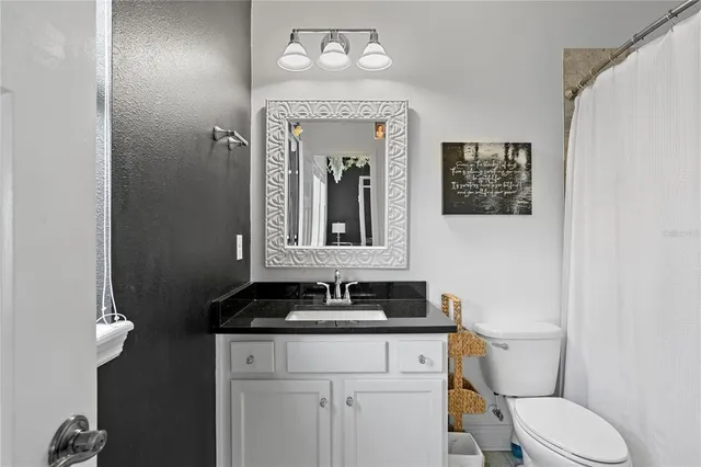 a living room with furniture a fireplace and a book shelf