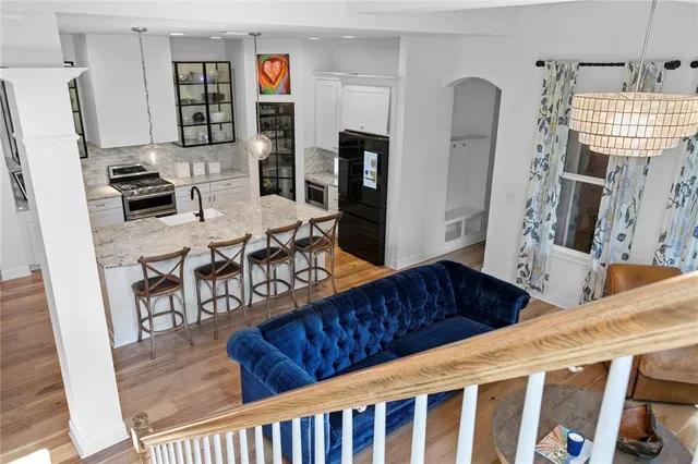a view of a house with a yard and potted plants