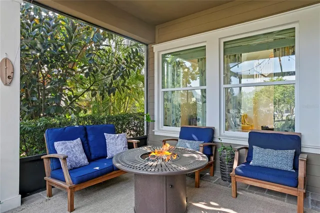 an aerial view of residential houses with outdoor space and swimming pool