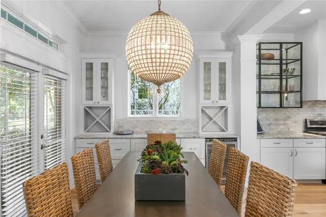 a kitchen with stainless steel appliances kitchen island granite countertop a stove a sink and a microwave