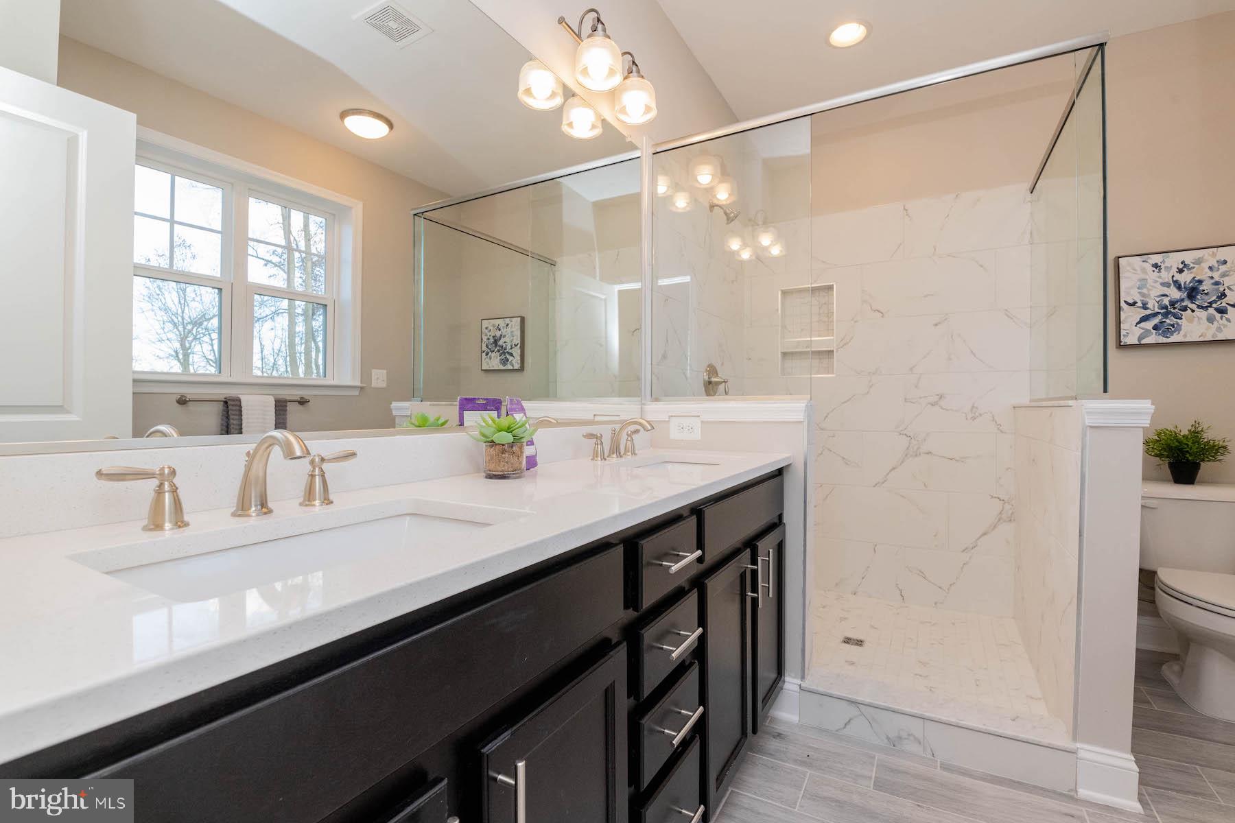 Margate York Road Parkton, MD 21120 - Photo 16 of 21 a bathroom with a granite countertop sink a large mirror and a shower