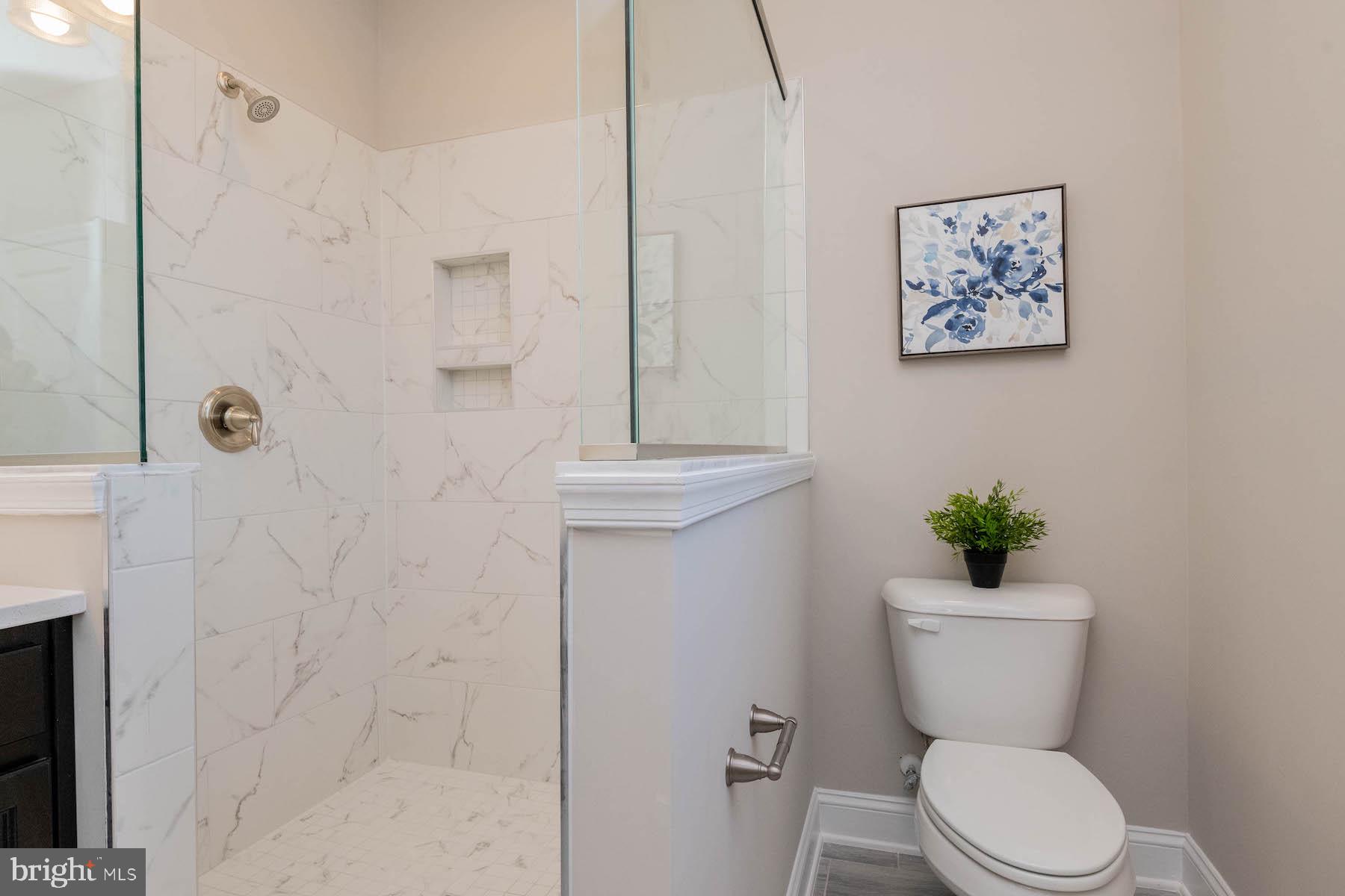 Margate York Road Parkton, MD 21120 - Photo 17 of 21 a bathroom with a toilet a sink and shower