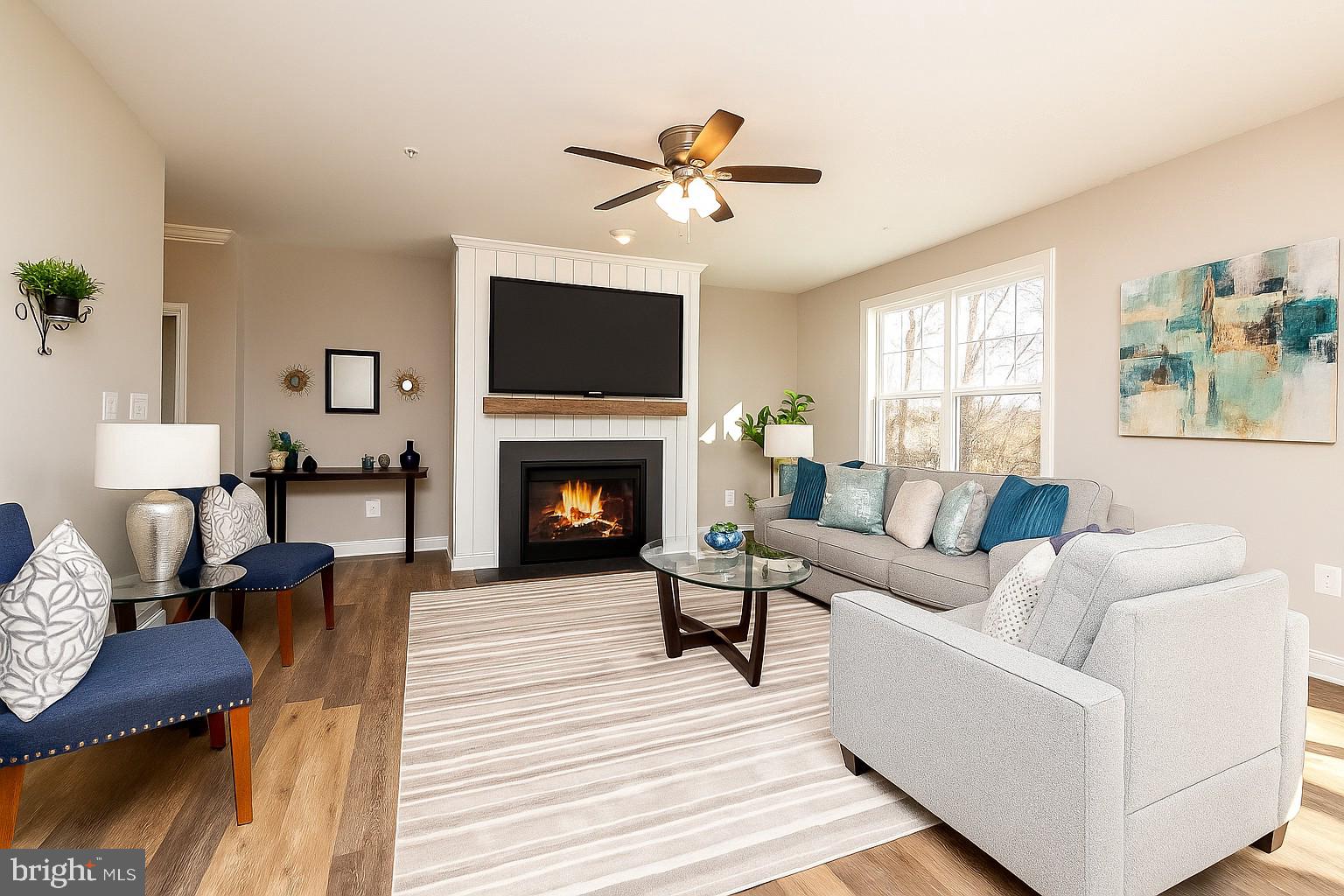 Margate York Road Parkton, MD 21120 - Photo 6 of 21 a living room with furniture a fireplace and a flat screen tv