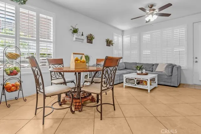 a dining room with furniture and window