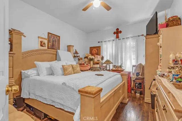 a bed room with bed and a chandelier