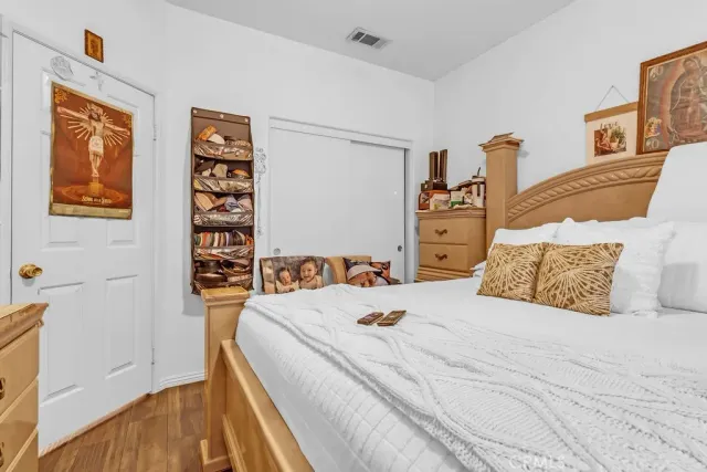 a bedroom with a bed and a couch