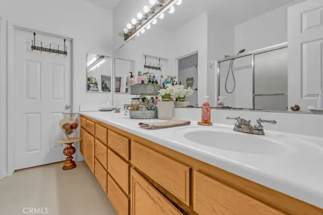 a bathroom with a double vanity sink mirror and double