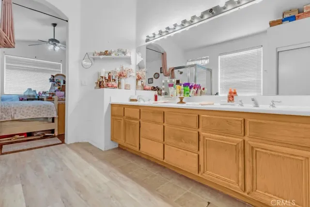 a view of kitchen with cabinets and window