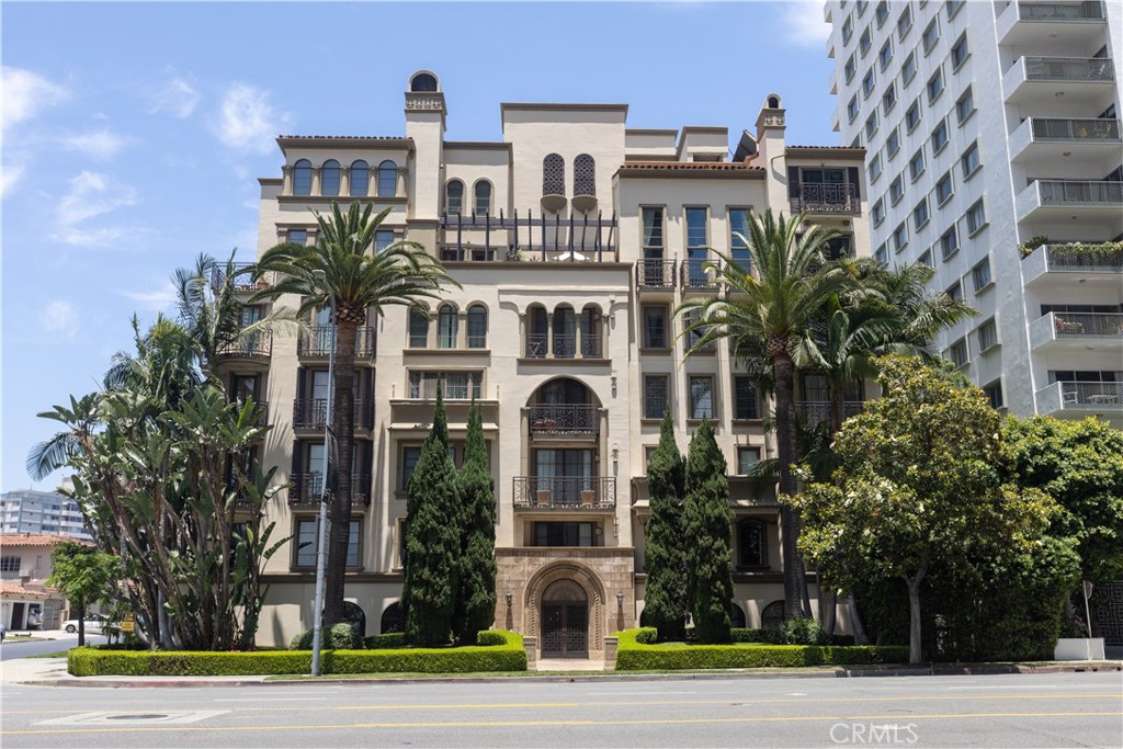 a front view of a building with a yard
