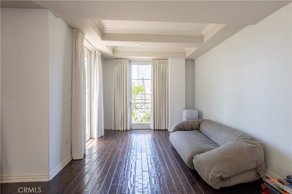 10795 Wilshire Boulevard, Unit 402 Los Angeles, CA 90024 - Photo 15 of 20 a living room with furniture and a window
