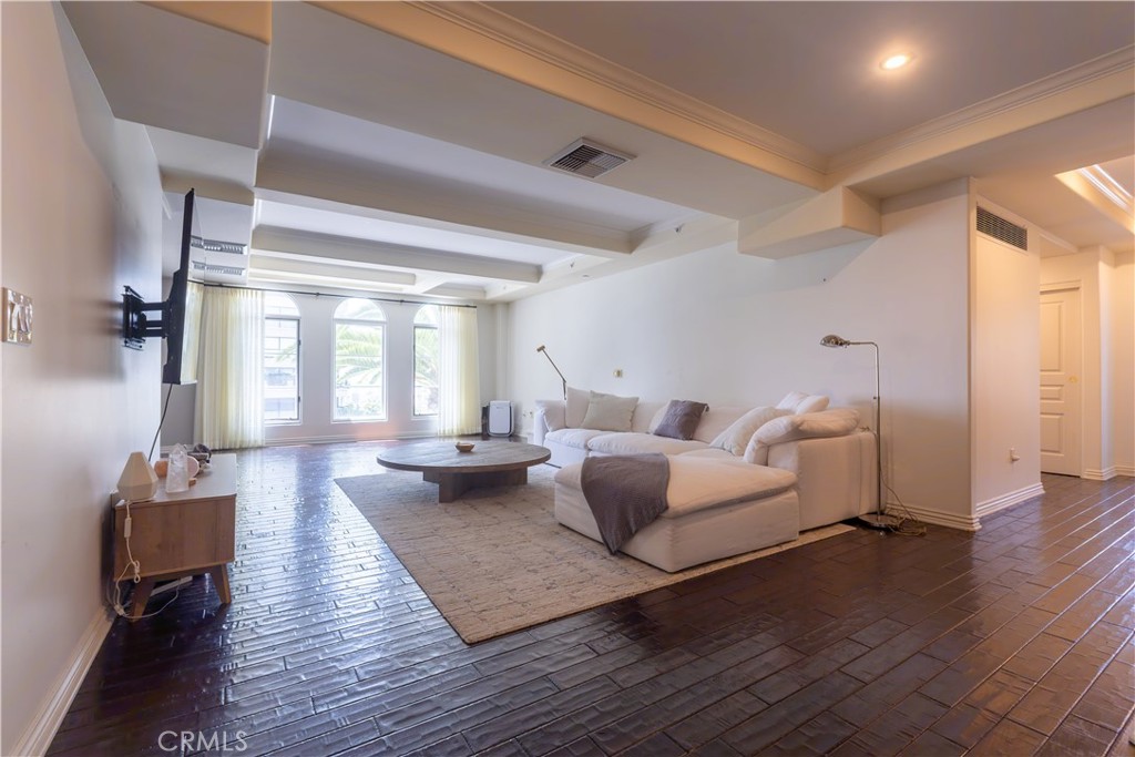 10795 Wilshire Boulevard, Unit 402 Los Angeles, CA 90024 - Photo 3 of 20 a living room with furniture and a wooden floor
