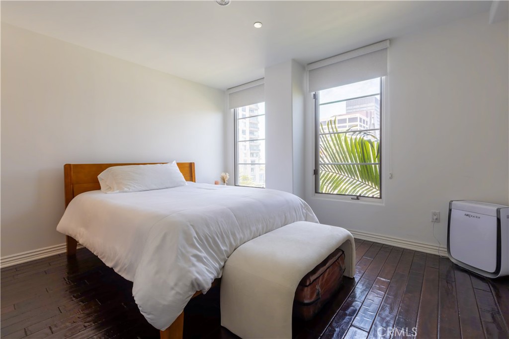 10795 Wilshire Boulevard, Unit 402 Los Angeles, CA 90024 - Photo 10 of 20 a bedroom with a bed and a window