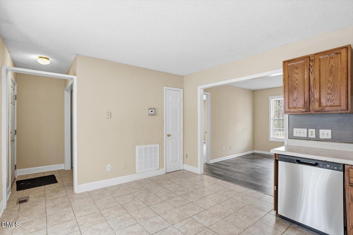 1013 Spawn Place Knightdale, NC 27545 - Photo 13 of 22 a view of a kitchen with a sink cabinets and a window