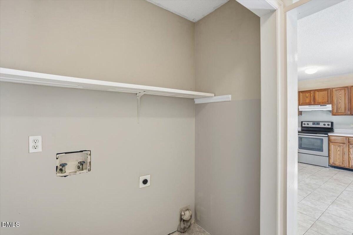 1013 Spawn Place Knightdale, NC 27545 - Photo 14 of 22 a view of kitchen and bathroom with sink