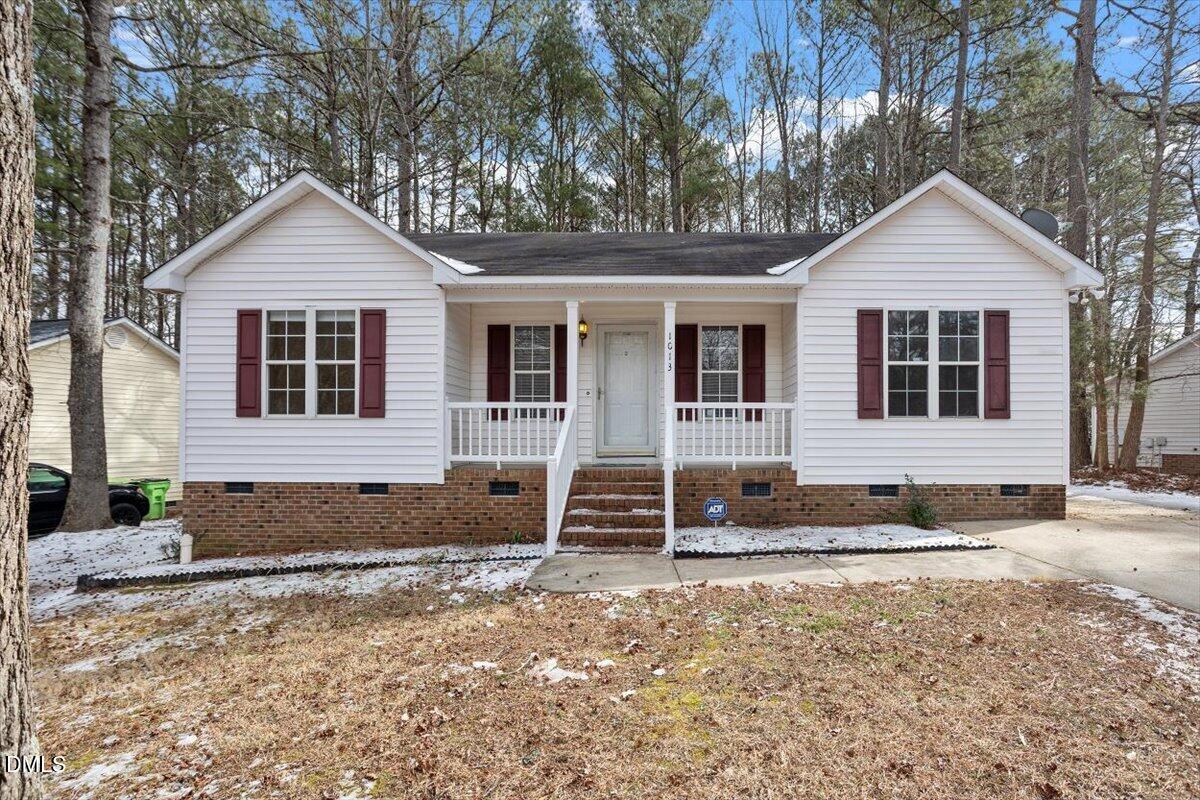 1013 Spawn Place Knightdale, NC 27545 - Photo 2 of 22 a front view of a house with a yard