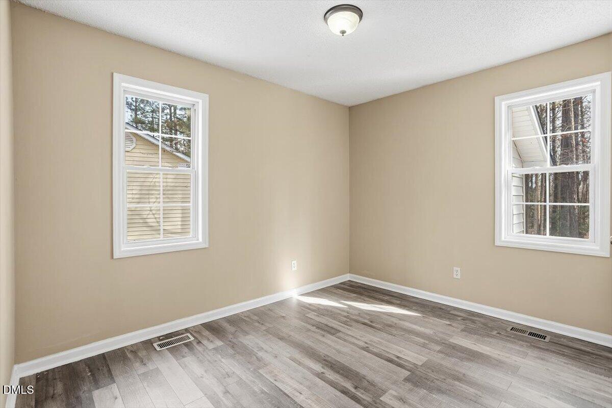 1013 Spawn Place Knightdale, NC 27545 - Photo 21 of 22 an empty room with a window