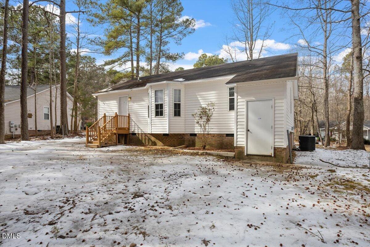 1013 Spawn Place Knightdale, NC 27545 - Photo 7 of 22 a view of a grey house with a yard