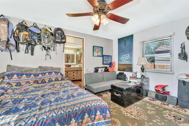 a bedroom with a bed and a couch