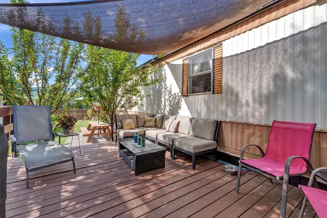 a outdoor living space with patio furniture and wooden floor