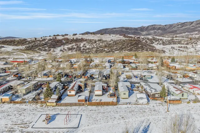 an aerial view of residential houses with outdoor space