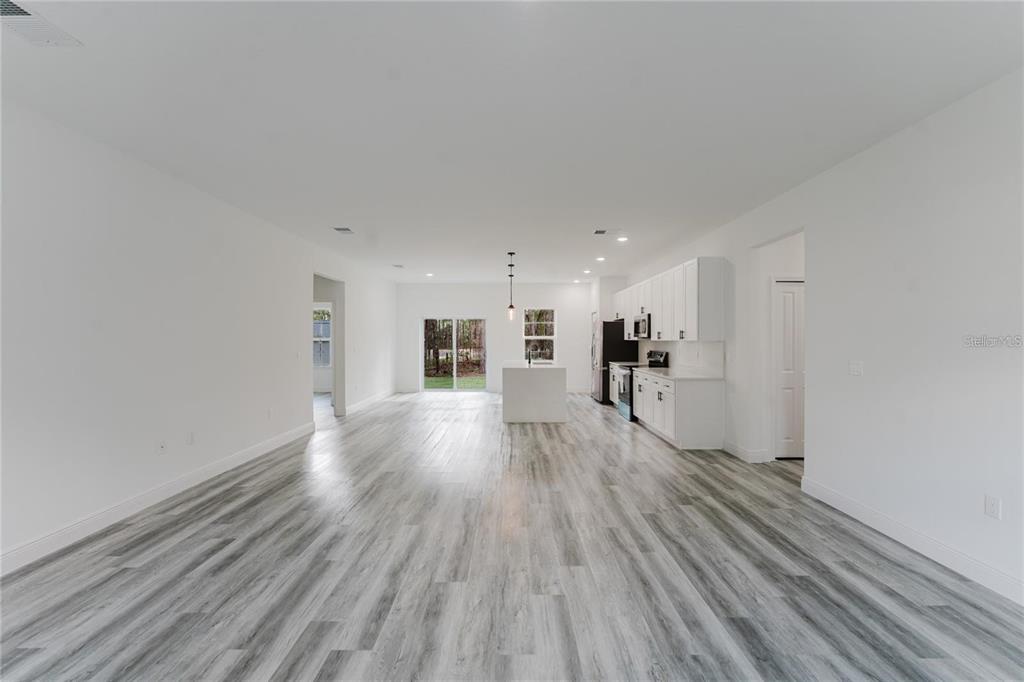 6732 Southwest 132nd Street Ocala, FL 34473 - Photo 5 of 36 a view of a livingroom with wooden floor