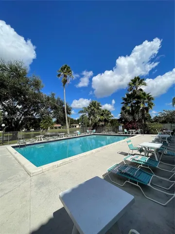 a view of a house with basketball court