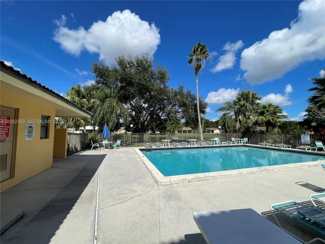 a view of a swimming pool with a patio