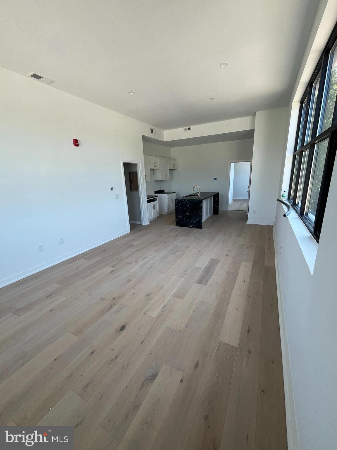 36 North Narberth Avenue, Unit 2D Narberth, PA 19072 - Photo 8 of 10 an empty room with furniture and fireplace