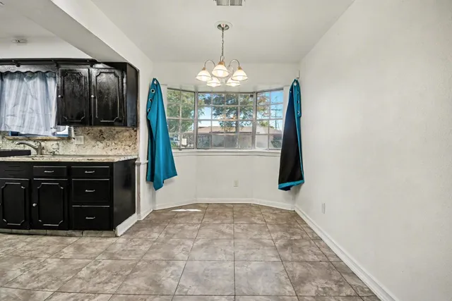 a kitchen with a sink and a refrigerator