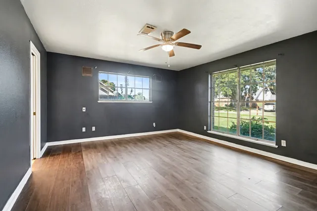 a bathroom with a bathtub and a toilet
