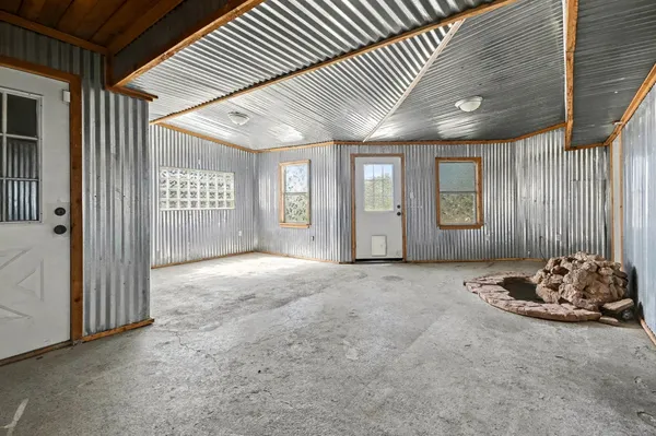 a view of a livingroom with a bed and roof