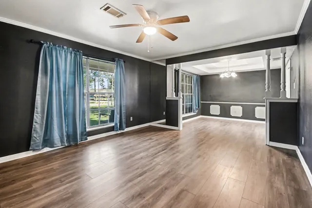 a view of gallery with wooden floor