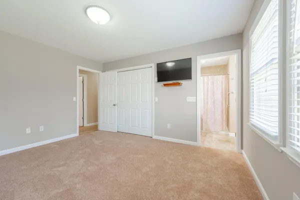 a view of an empty room with a window