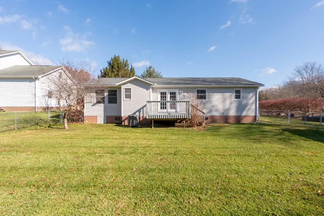 a front view of house with yard and seating