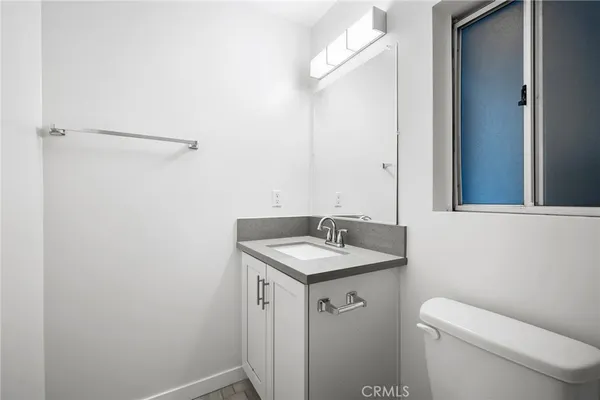 a white bath tub sitting next to a toilet