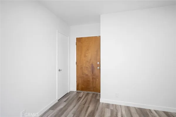 a view of a small space with wooden floor