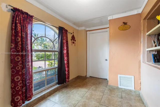 a view of a entryway door of the room