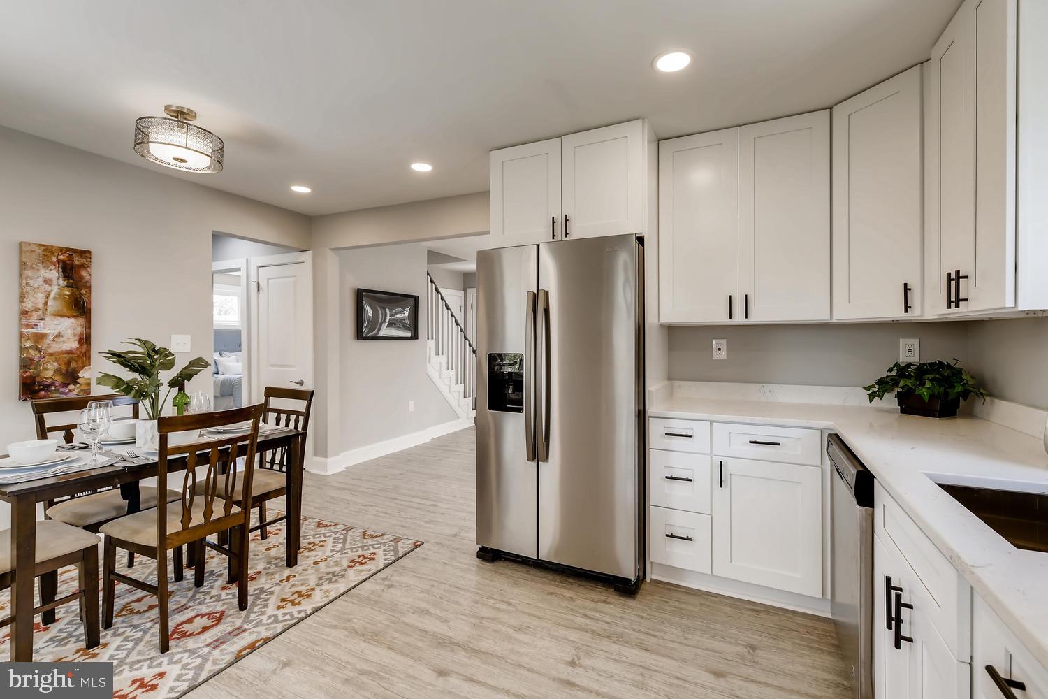 3407 Fairview Road Baltimore, MD 21207 - Photo 7 of 27 Kitchen with SS Appliances and White Cabinets