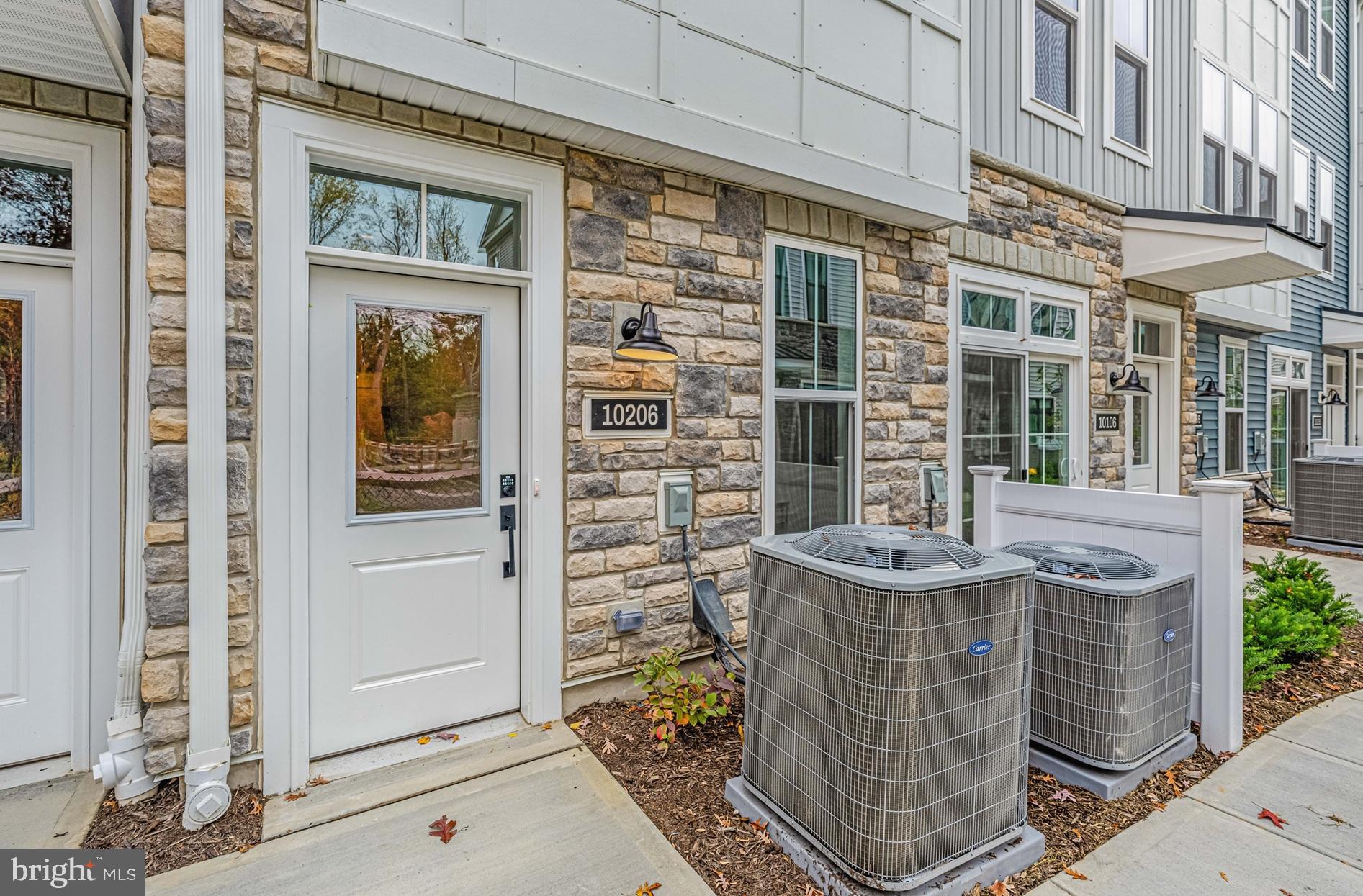 10206 Donatello Drive Princeton, NJ 08540 - Photo 3 of 30 front view of a brick building with a door
