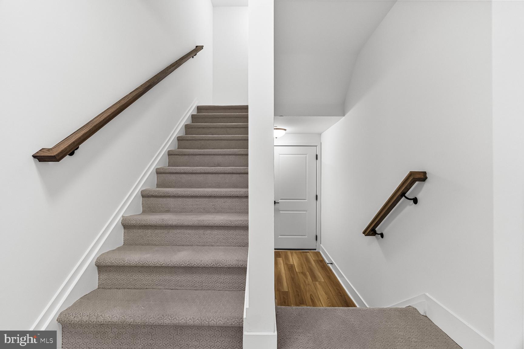 10206 Donatello Drive Princeton, NJ 08540 - Photo 5 of 30 a view of staircase with wooden floor and white walls