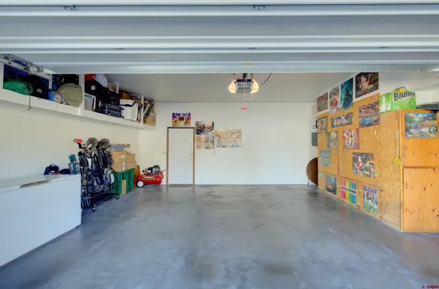 a view of a garage with rack and bicycle