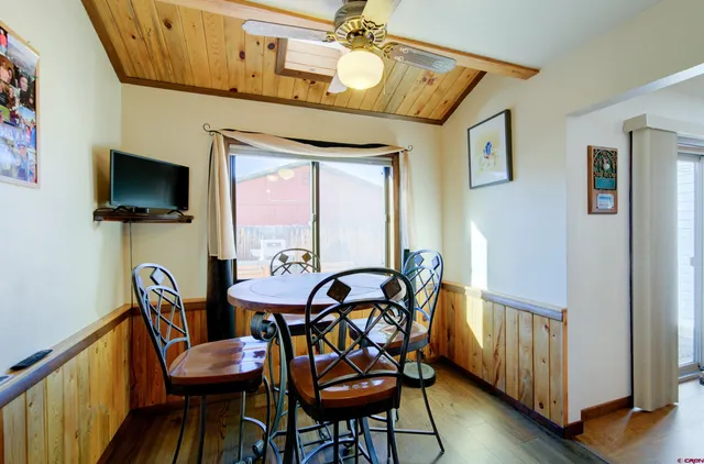 a view of a dining room with furniture window and wooden floor