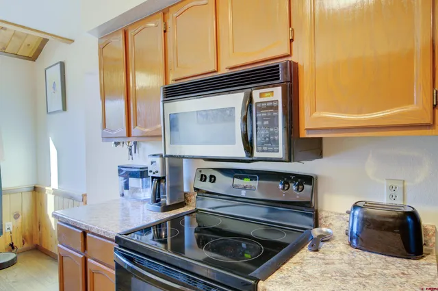 a kitchen with a stove and a microwave