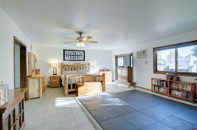 a view of a livingroom with furniture and window