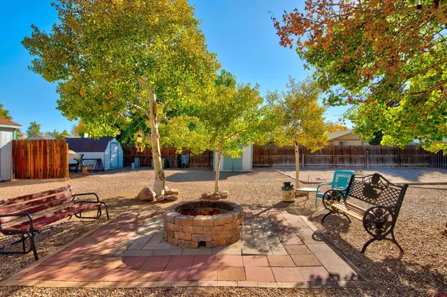 a view of a backyard with sitting area