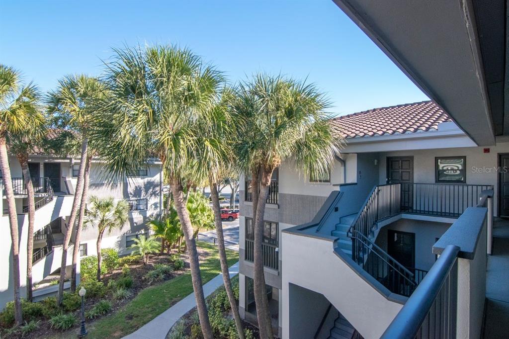 2650 Countryside Boulevard, Unit F303 Clearwater, FL 33761 - Photo 13 of 39 a front view of a house with garden