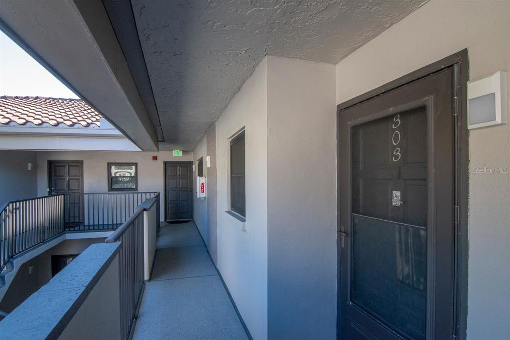 2650 Countryside Boulevard, Unit F303 Clearwater, FL 33761 - Photo 15 of 39 a view of hall way with furniture and windows